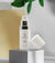 rococco peptide serum standing on a box with lid next to it